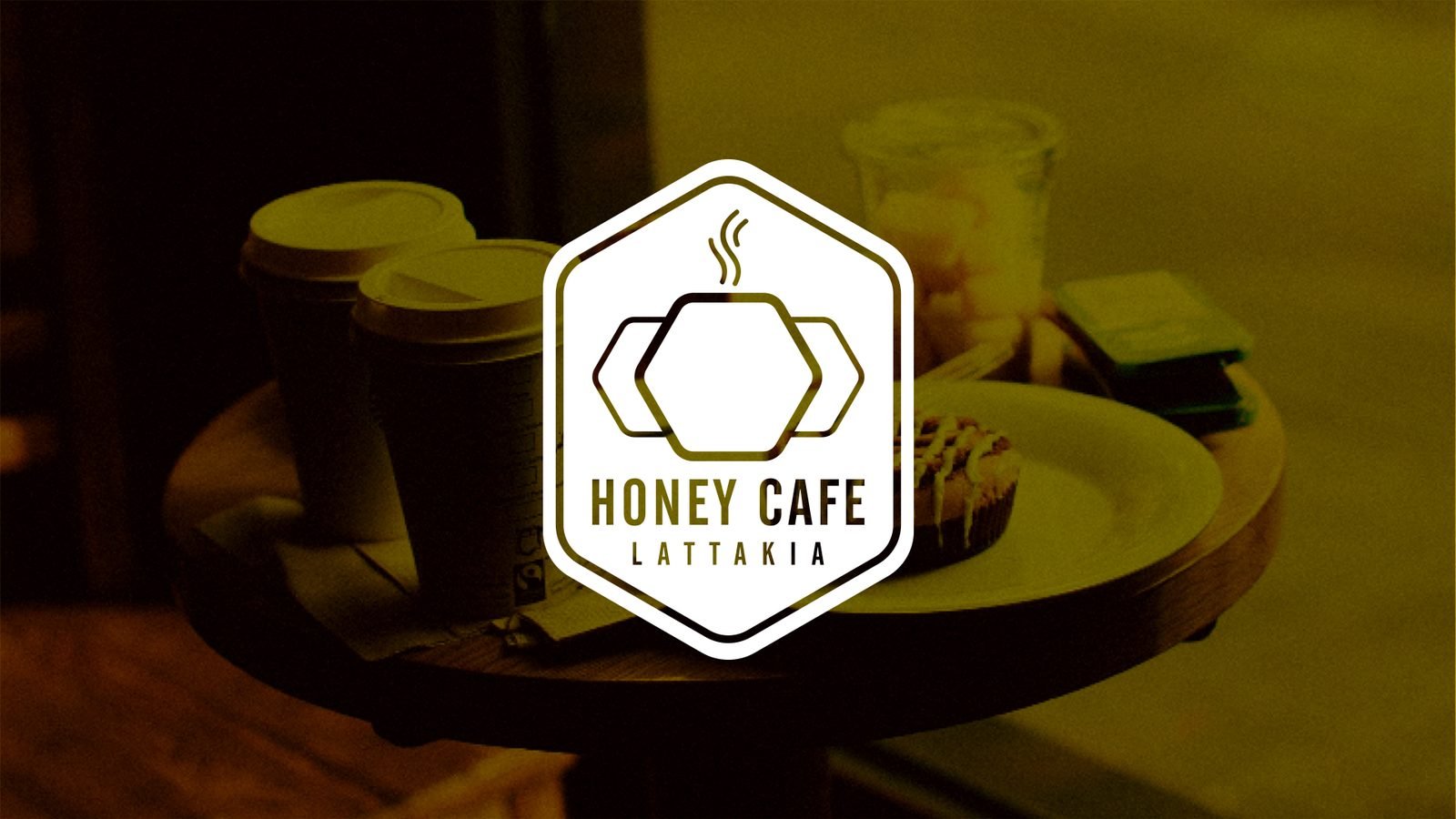 Honey Cafe: The logo over café photography