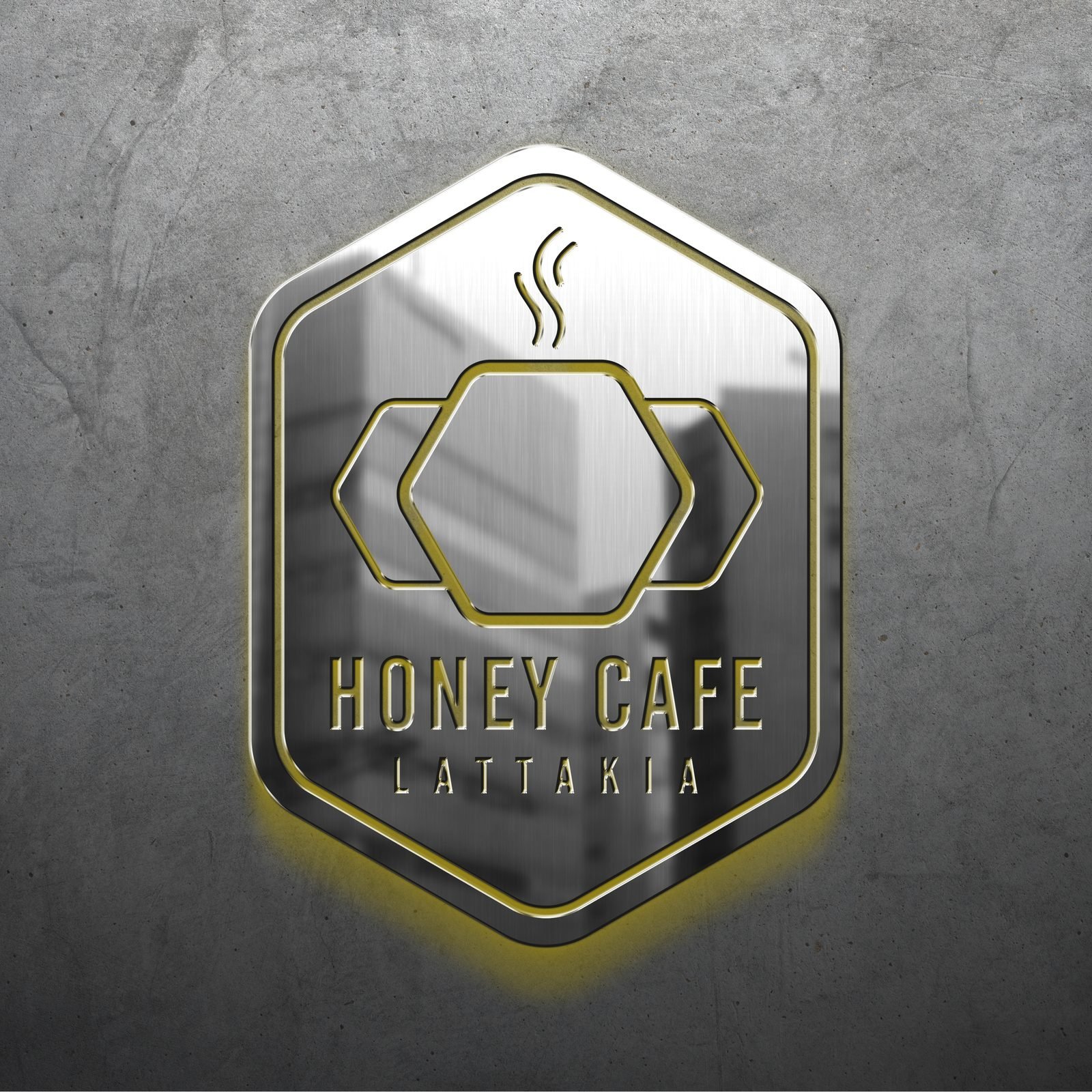 Honey Cafe: Illuminated logo on a concrete wall