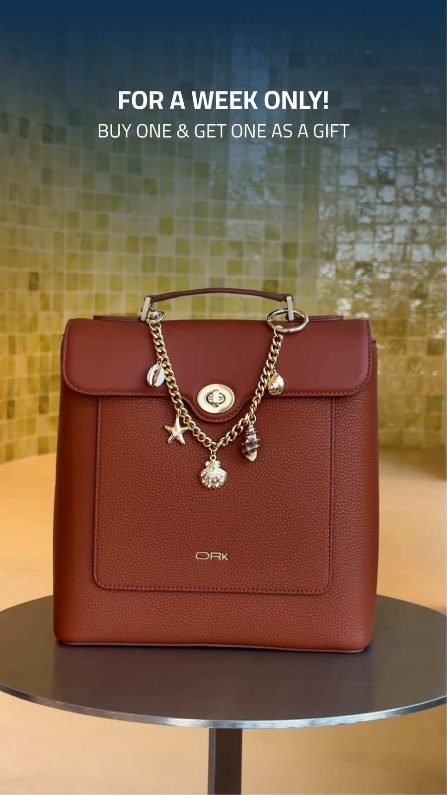 ORK: The cognac backpack with gold charms